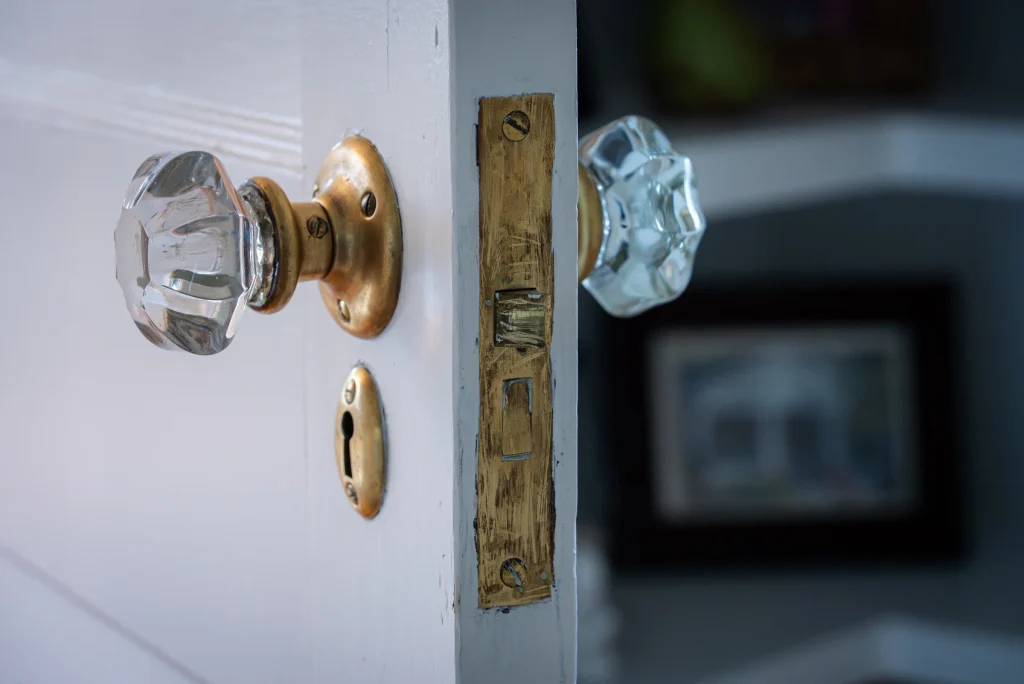period-appropriate crystal doorknob - Asheville home renovation