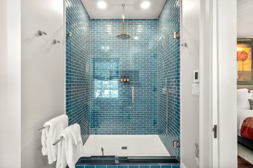bathroom shower remodel with blue tile