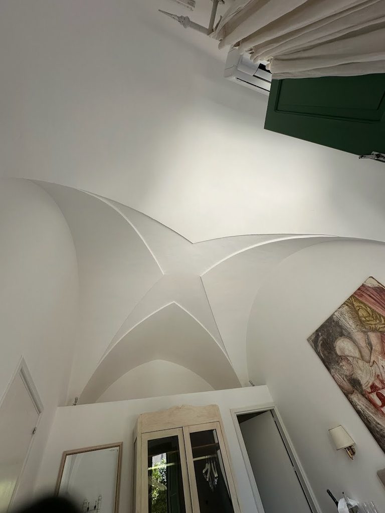Original Leccese stone star-vaulted ceilings are a part of the structural system of the architecture at Palazzo Ducale Venturi.